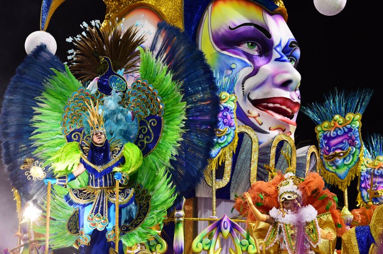 TOPSHOTS Revelers of the Academicos do Tucuruvi samba school perform during the first night of carnival parade at the Anhembi Sambadrome in Sao Paulo Brazil on February 13, 2015. AFP PHOTO / NELSON ALMEIDA